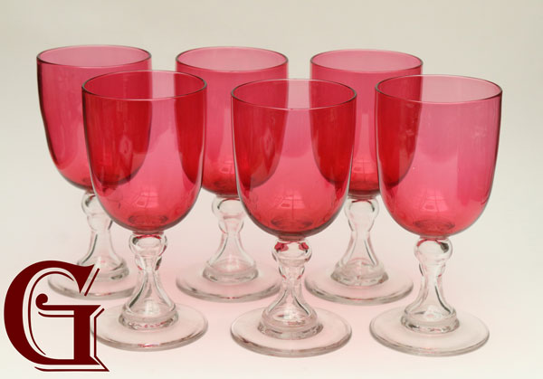 six large cranberry wine goblets